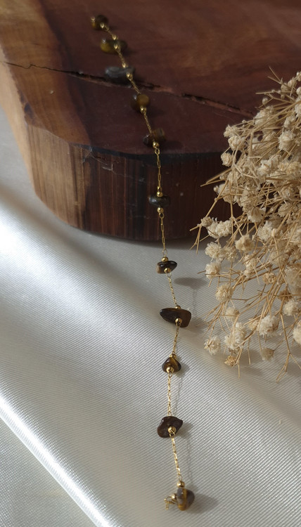 دستبند زنجیری استیل طلایی و سنگ چشم ببر